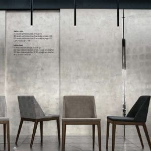 Sedia Tomasella modello Lolita, geometrica ma avvolgente, in equilibrio tra la naturale vocazione al comfort e la voglia di stupire.